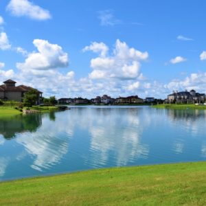 An image showcases Riverstone Fort Bend County's lake view in Sugar Land, Texas.