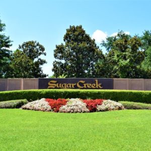 An image of the Country Club at Sugar Creek, a modern residential-scale neighborhood located in the eastern part of Sugar Land, TX.